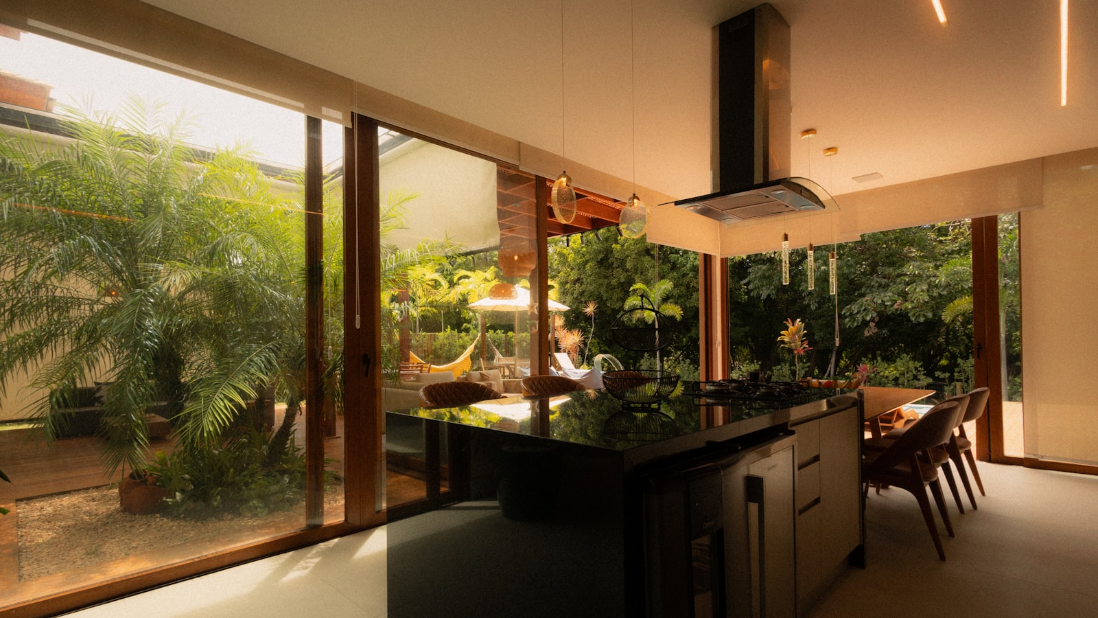 A modern kitchen island with a garden view