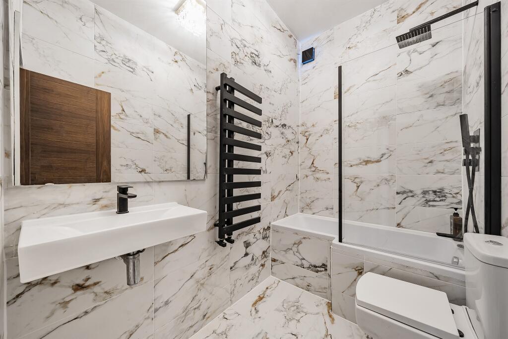 A luxury bathroom with a freestanding bathtub