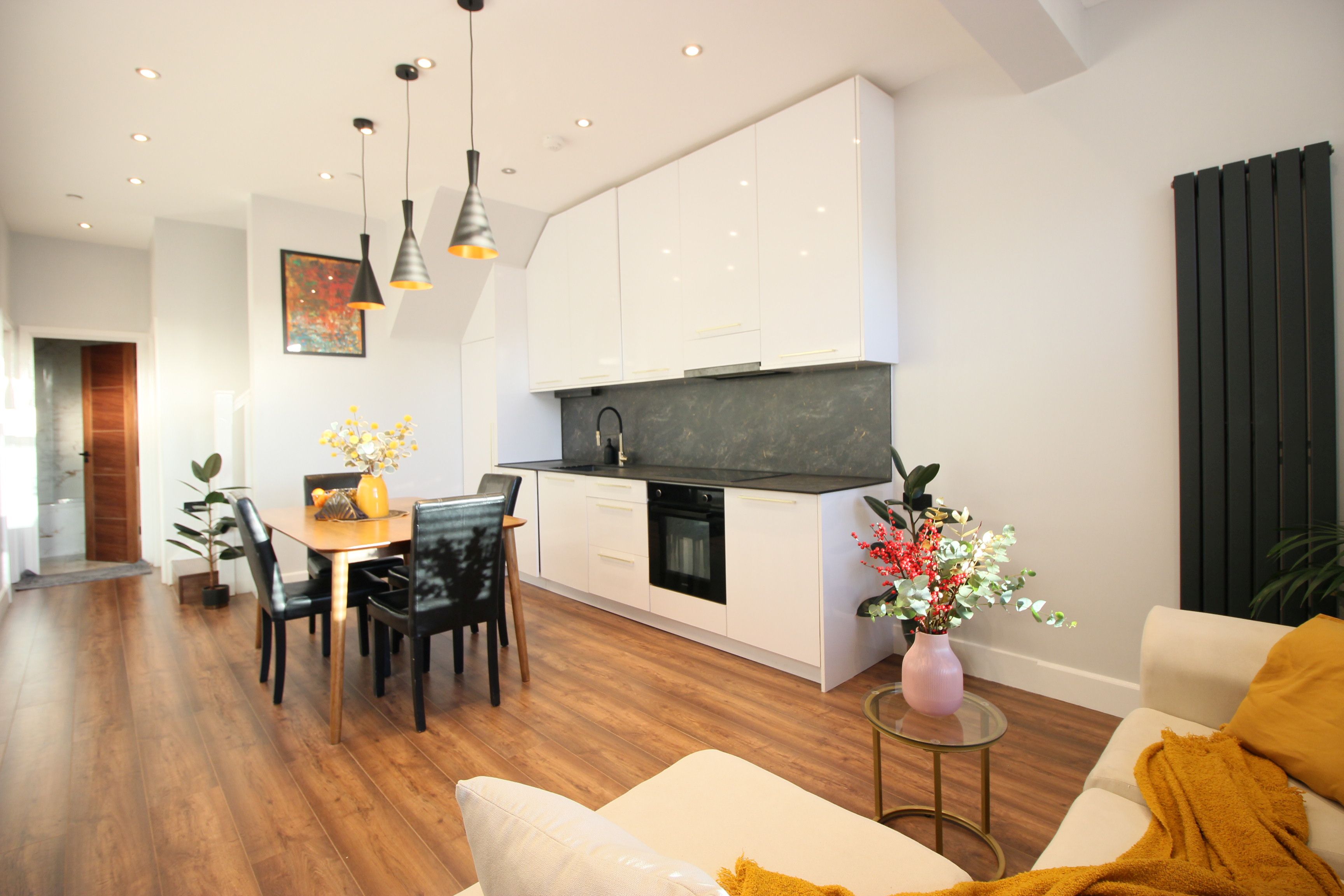A bright room with natural wood flooring