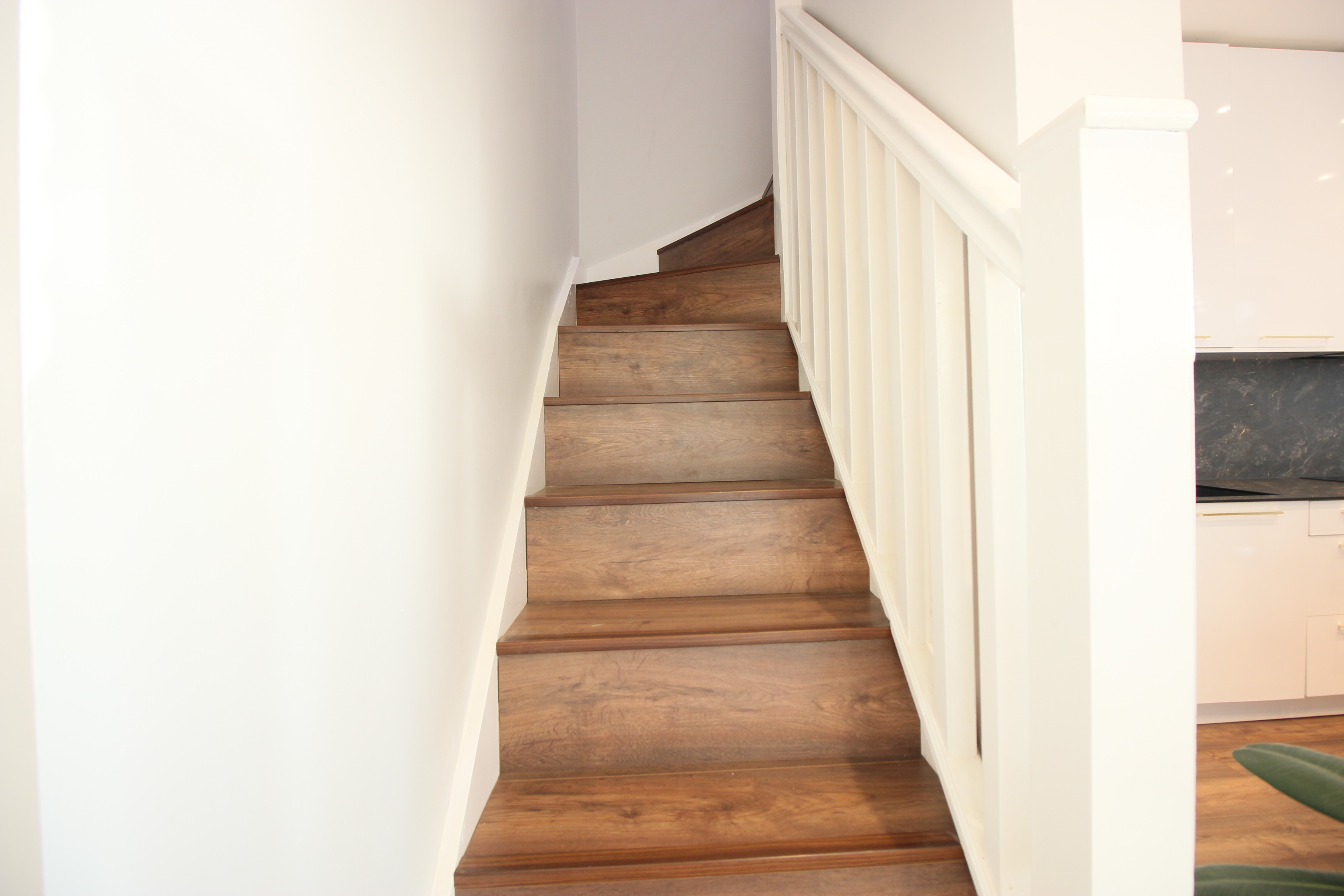 A carpenter cutting a piece of wood